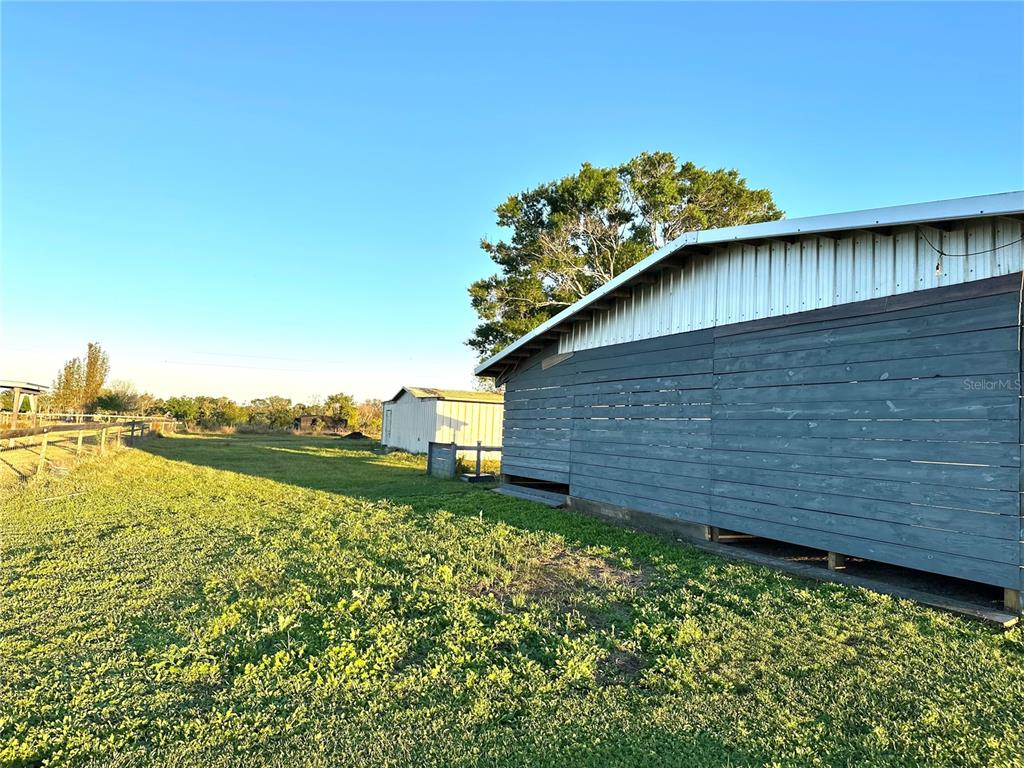 35495 Singletary Road Myakka City, FL 34251 - Photo 42 of 74 a backyard of a house with lots of green space and lake view