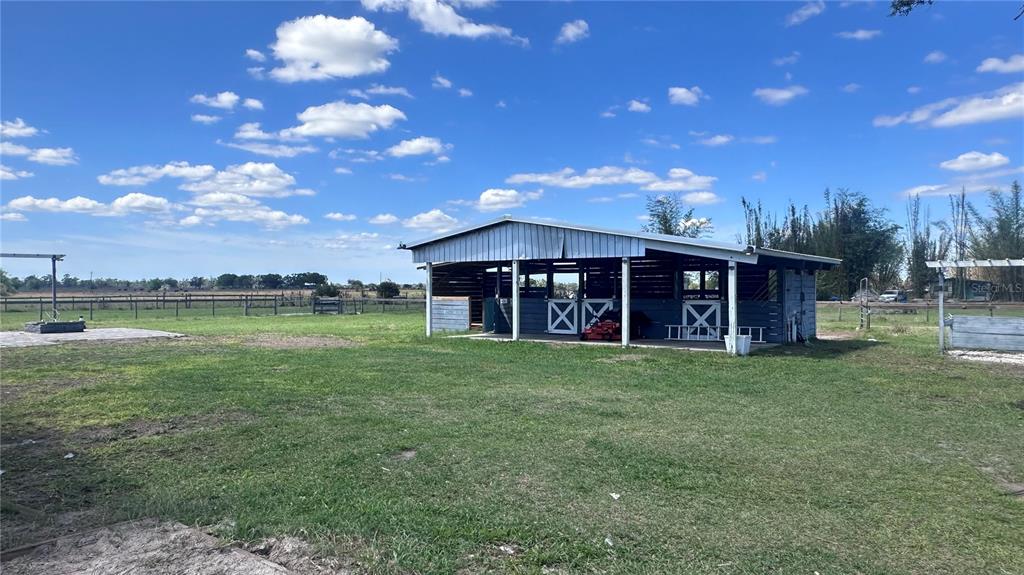 35495 Singletary Road Myakka City, FL 34251 - Photo 57 of 74 a view of a house with a yard