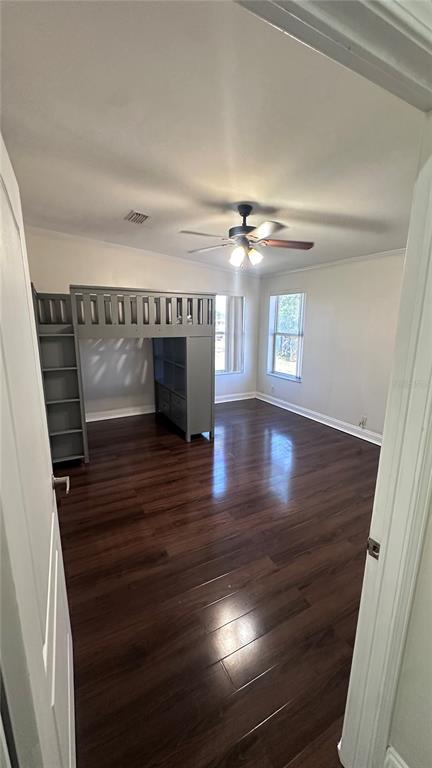 35495 Singletary Road Myakka City, FL 34251 - Photo 73 of 74 a view of an empty room and wooden floor