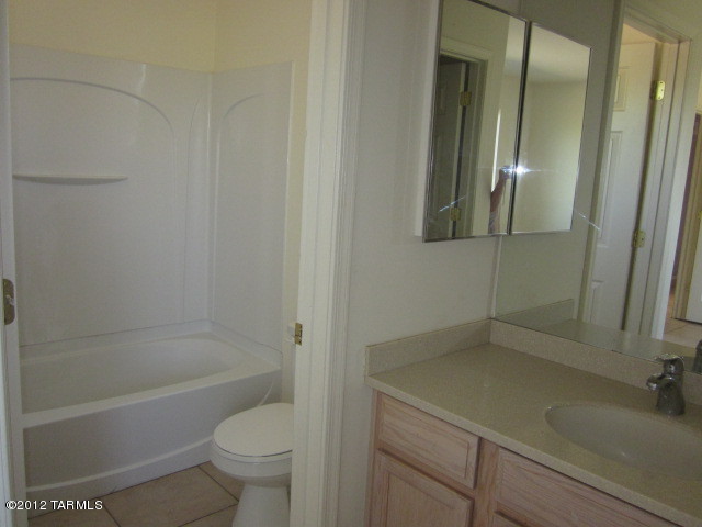 70 Círculo Cortez Rio Rico, AZ 85648 - Photo 13 of 13 a bathroom with a sink a toilet and shower