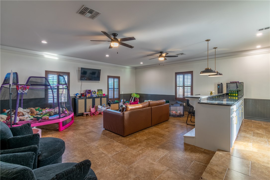 108 County Road 1601 Alice, TX 78332 - Photo 14 of 32 a living room with furniture and kitchen view