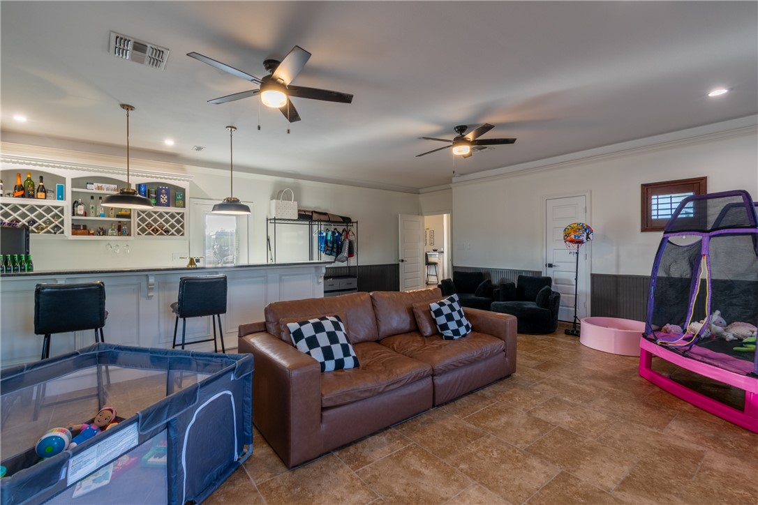 108 County Road 1601 Alice, TX 78332 - Photo 15 of 32 a living room with furniture kitchen view and a chandelier