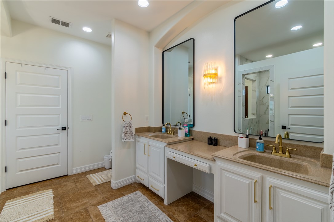 108 County Road 1601 Alice, TX 78332 - Photo 19 of 32 a bathroom with a double vanity sink and a mirror