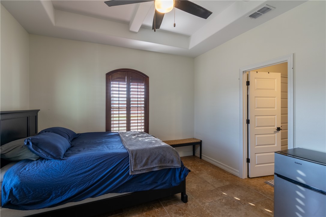 108 County Road 1601 Alice, TX 78332 - Photo 22 of 32 a spacious bedroom with a bed and a window