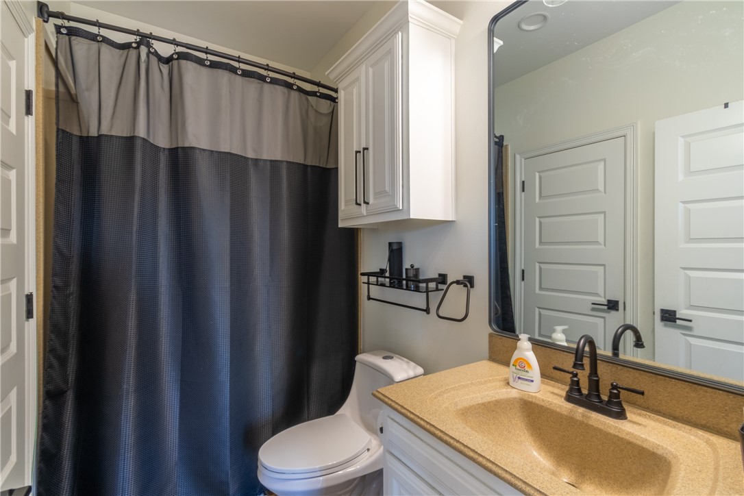 108 County Road 1601 Alice, TX 78332 - Photo 23 of 32 a bathroom with a sink a toilet and shower