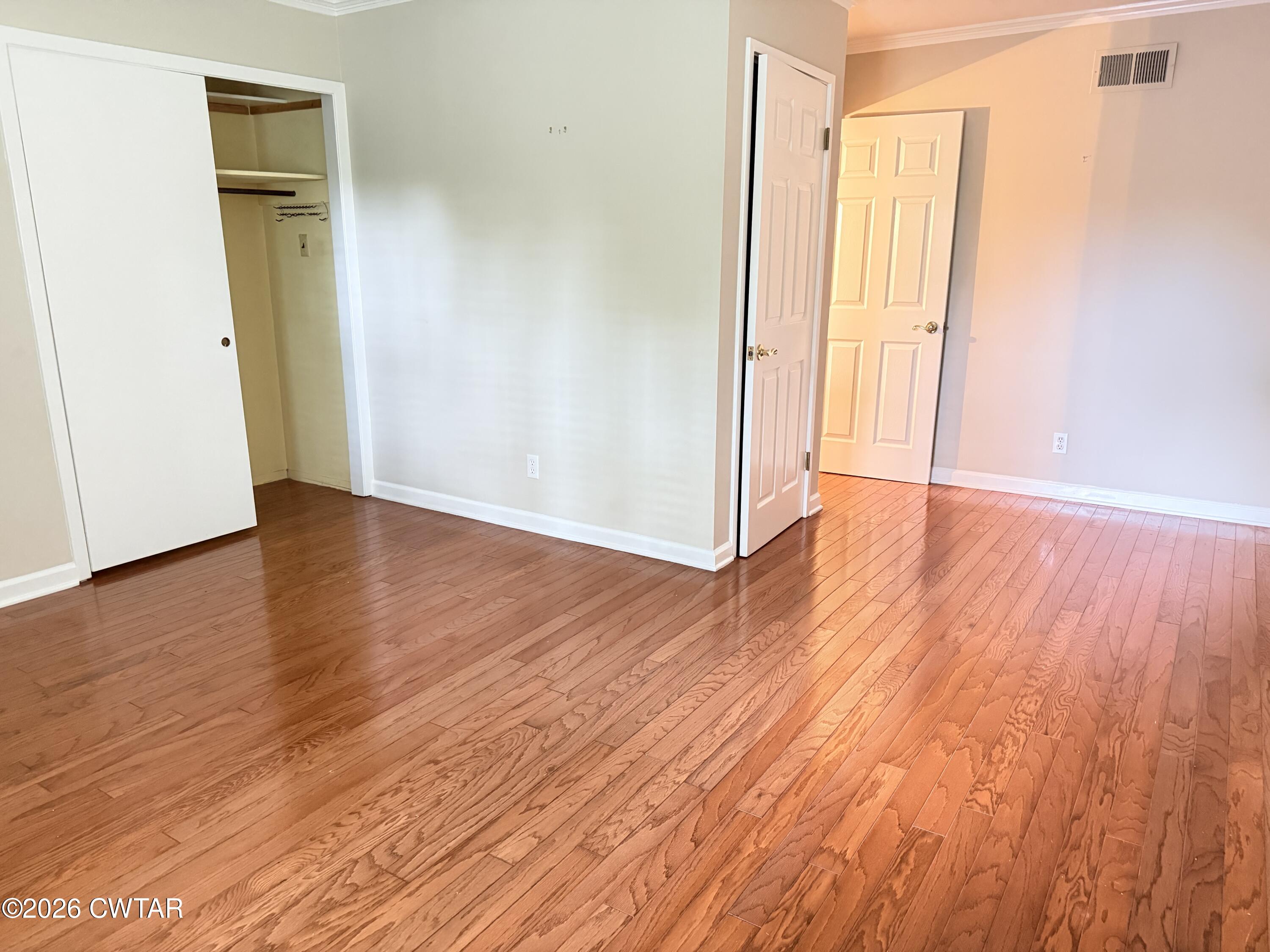 261 Lackey Lane Ripley, TN 38063 - Photo 34 of 48 a view of a hallway with wooden floor