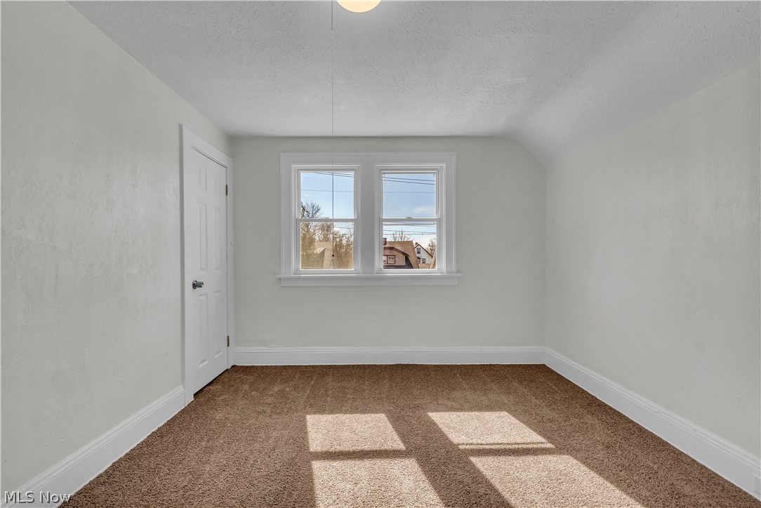 12905 Watterson Avenue Cleveland, OH 44105 - Photo 16 of 30 Additional living space featuring light carpet and baseboards