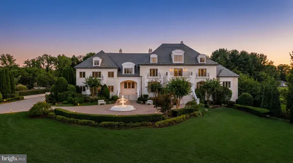 a front view of a house with a yard table and chairs