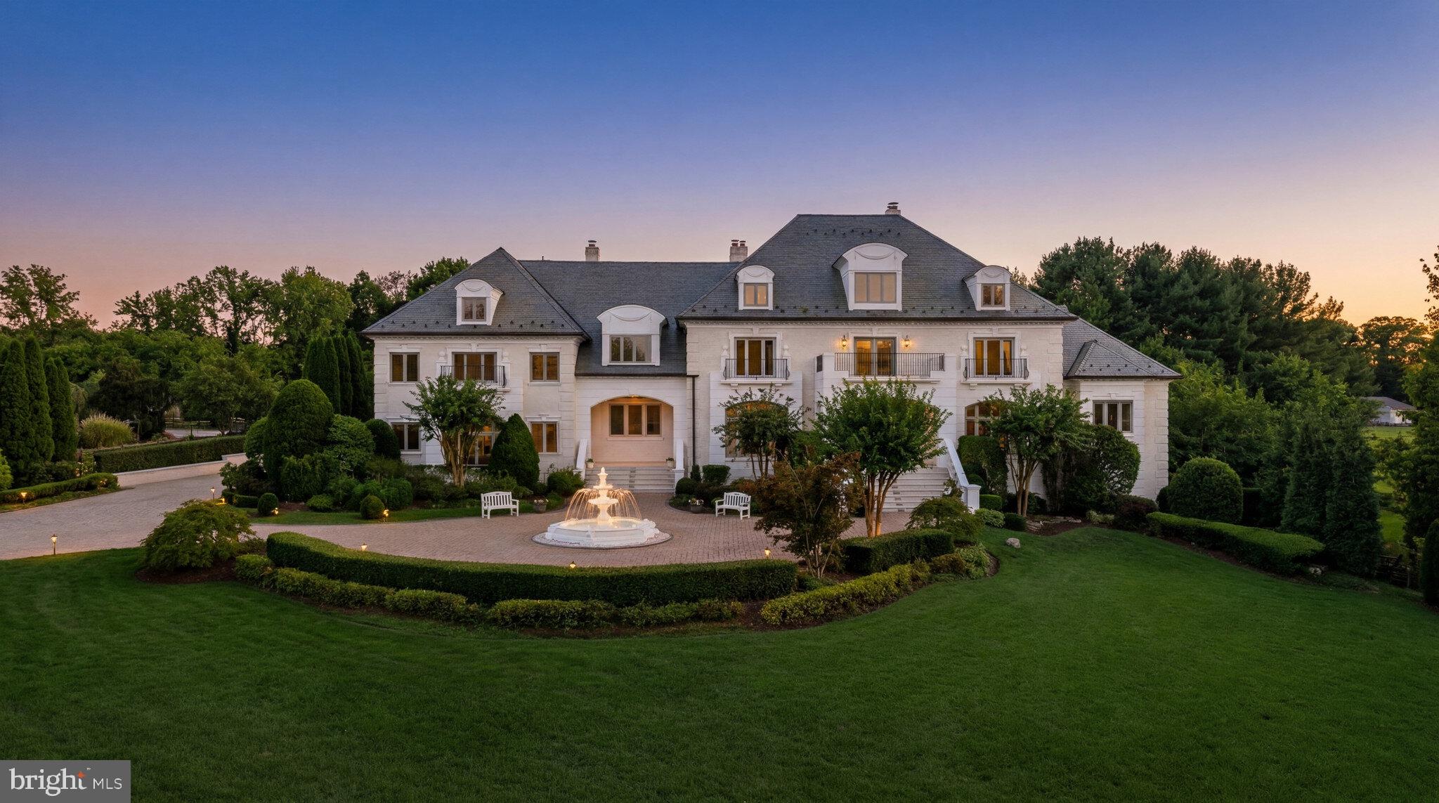 1521 Hunter Mill Road Vienna, VA 22182 - Photo 12 of 12 a front view of a house with a yard table and chairs