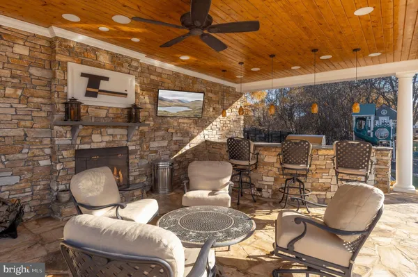 a dining room with furniture and wooden floor