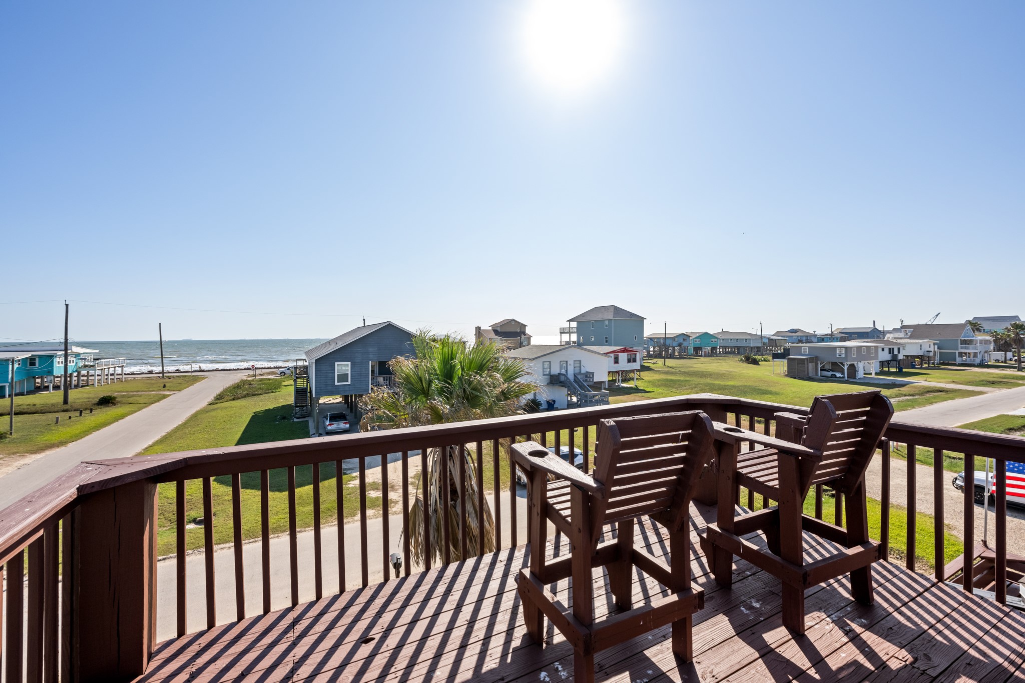 702 Seashell Drive Surfside Beach, TX 77541 - Photo 5 of 40 Just a short walk from the shoreline, this home offers easy beach access and sweeping water views from multiple angles.