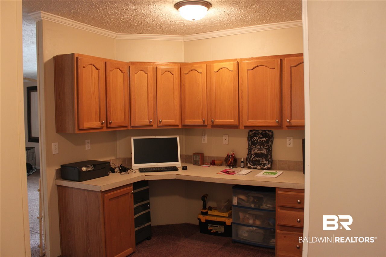 9380 Spice Pond Road Eight Mile, AL 36613 - Photo 27 of 36 Quiet office area with built-in desk & cabinets.