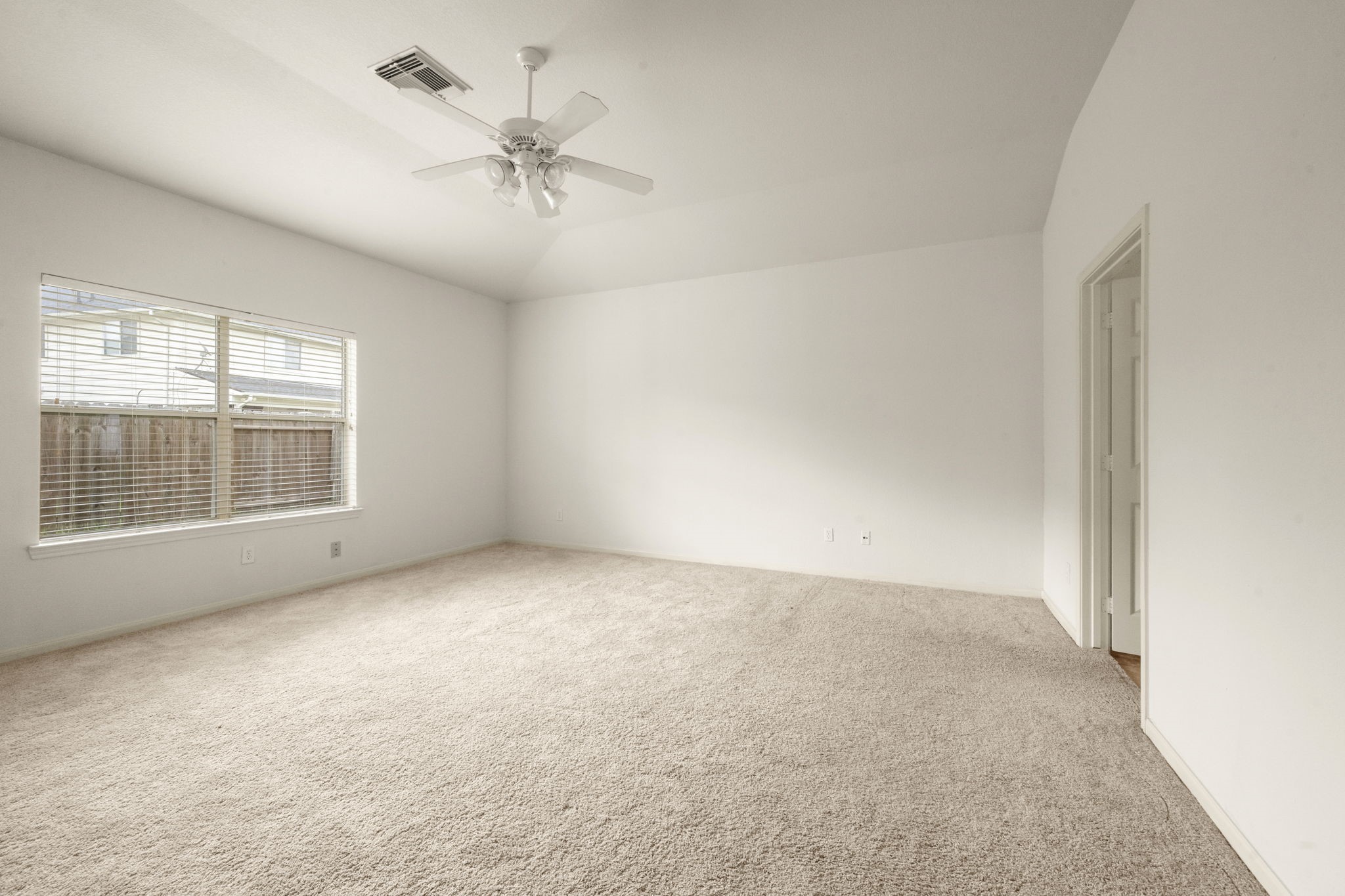 7803 Blue Lake Drive Rosenberg, TX 77469 - Photo 14 of 31 an empty room with windows and fan