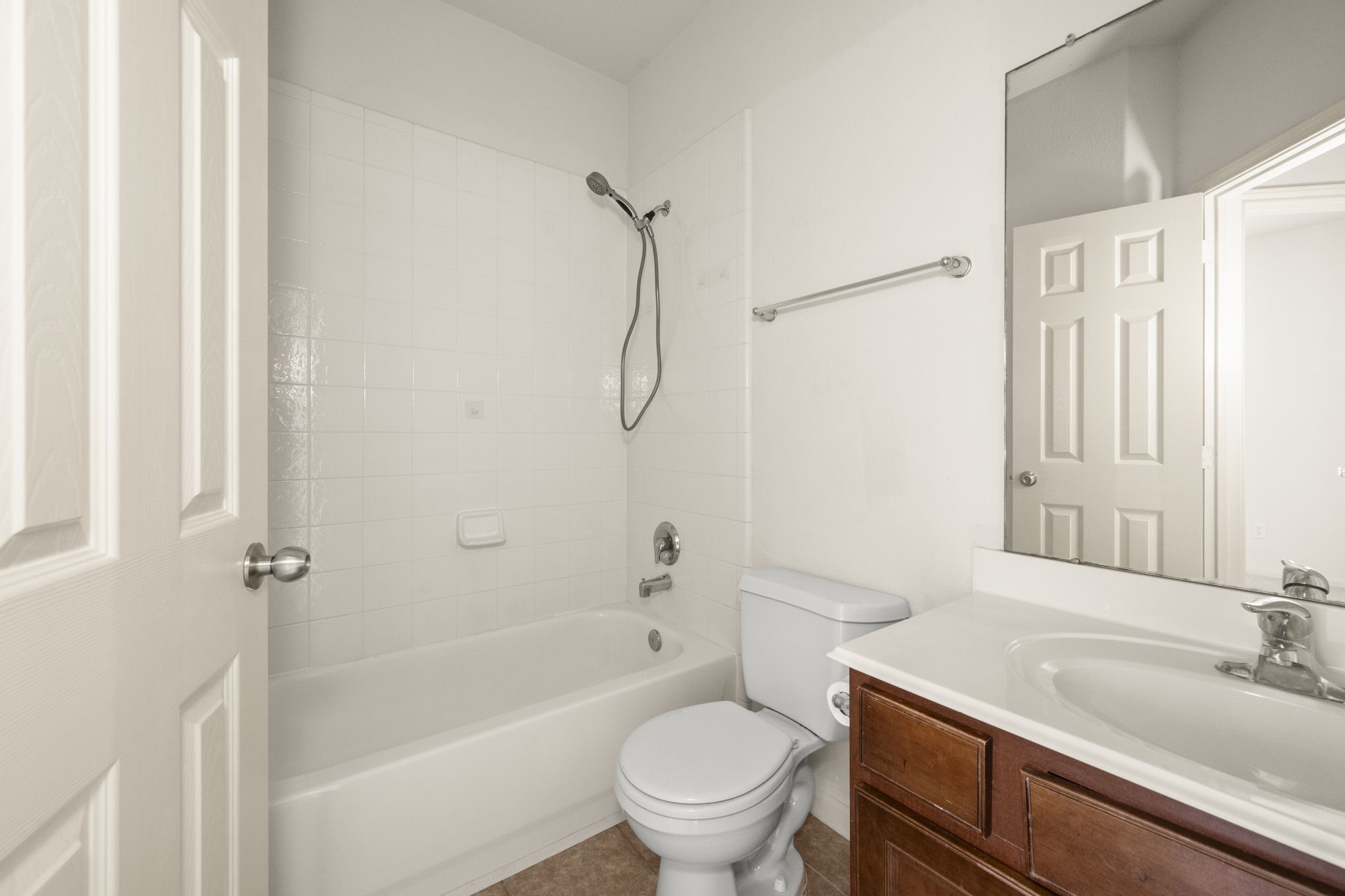 7803 Blue Lake Drive Rosenberg, TX 77469 - Photo 21 of 31 a bathroom with a granite countertop sink a toilet and shower