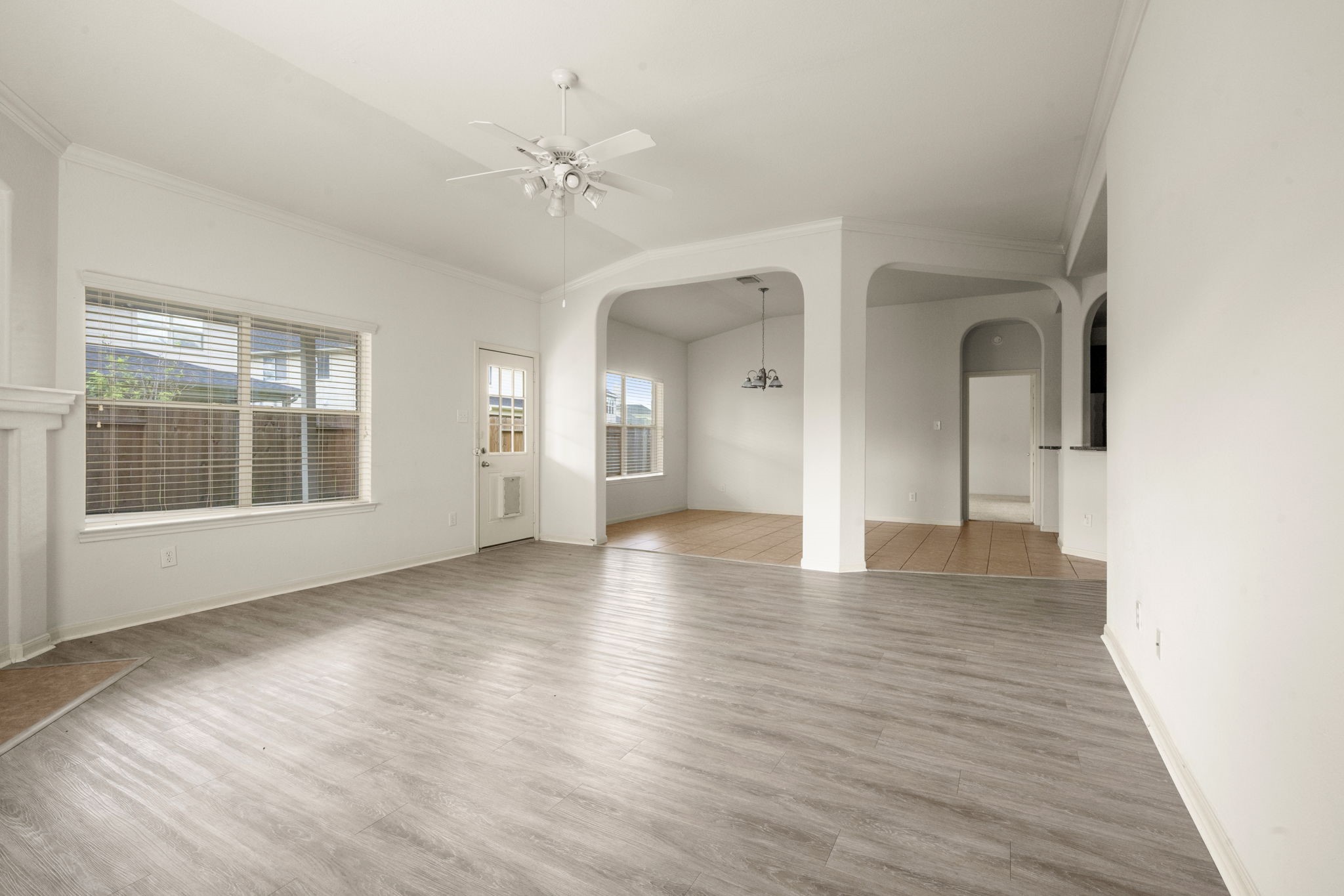 7803 Blue Lake Drive Rosenberg, TX 77469 - Photo 26 of 31 a view of an empty room with wooden floor and a window