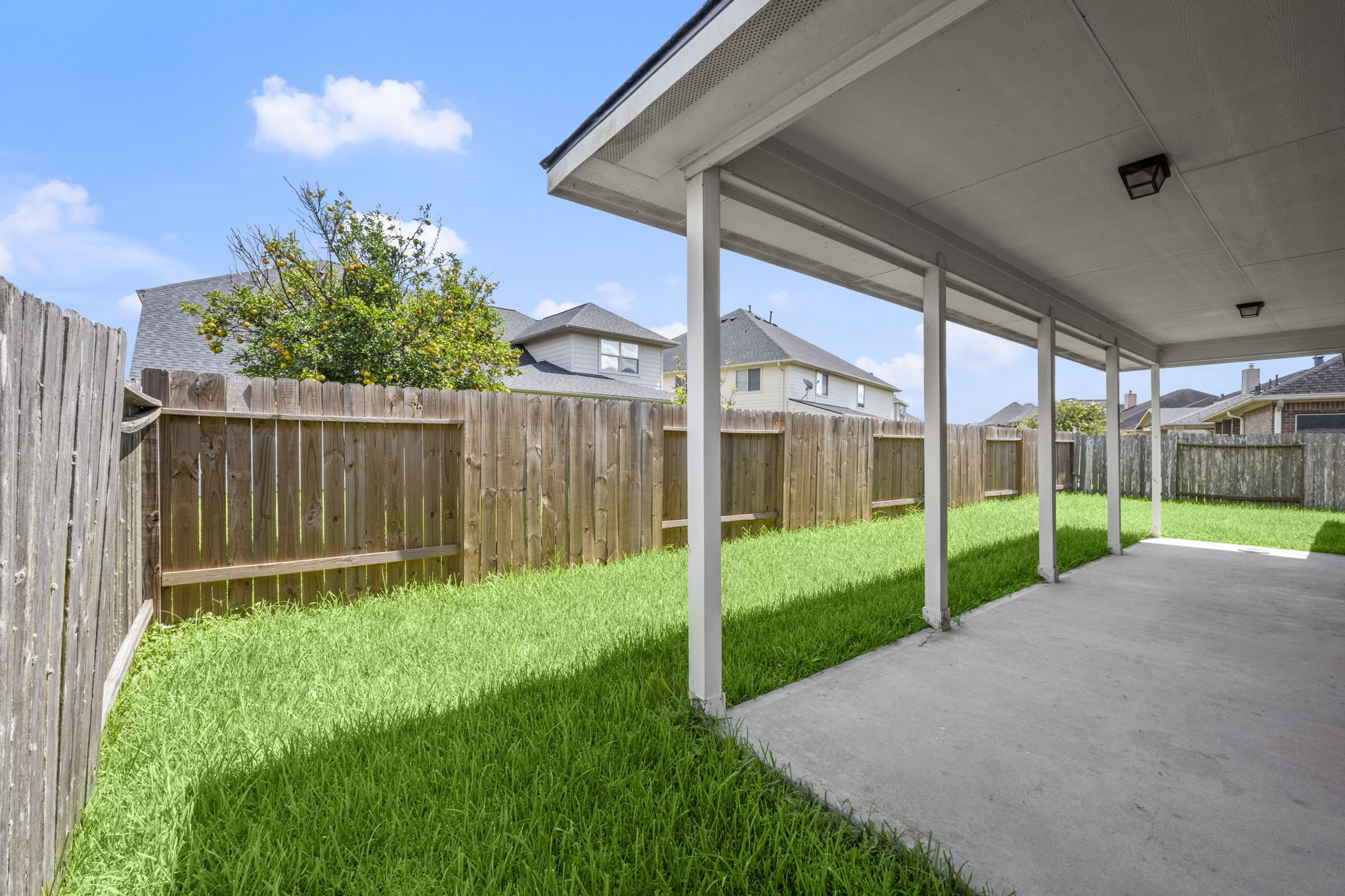 7803 Blue Lake Drive Rosenberg, TX 77469 - Photo 28 of 31 a view of a house with backyard and porch