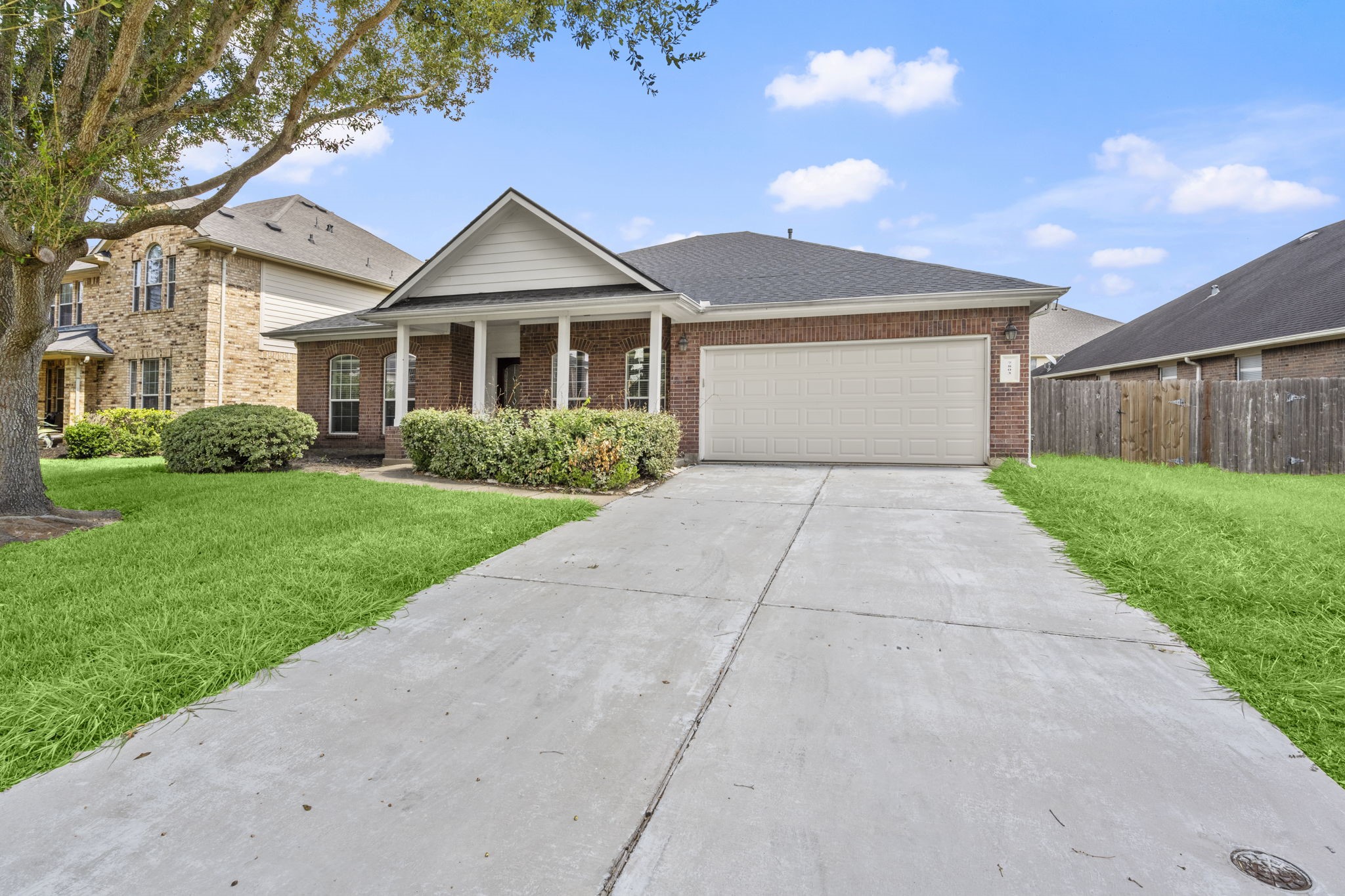 7803 Blue Lake Drive Rosenberg, TX 77469 - Photo 3 of 31 a front view of a house with a yard and garage