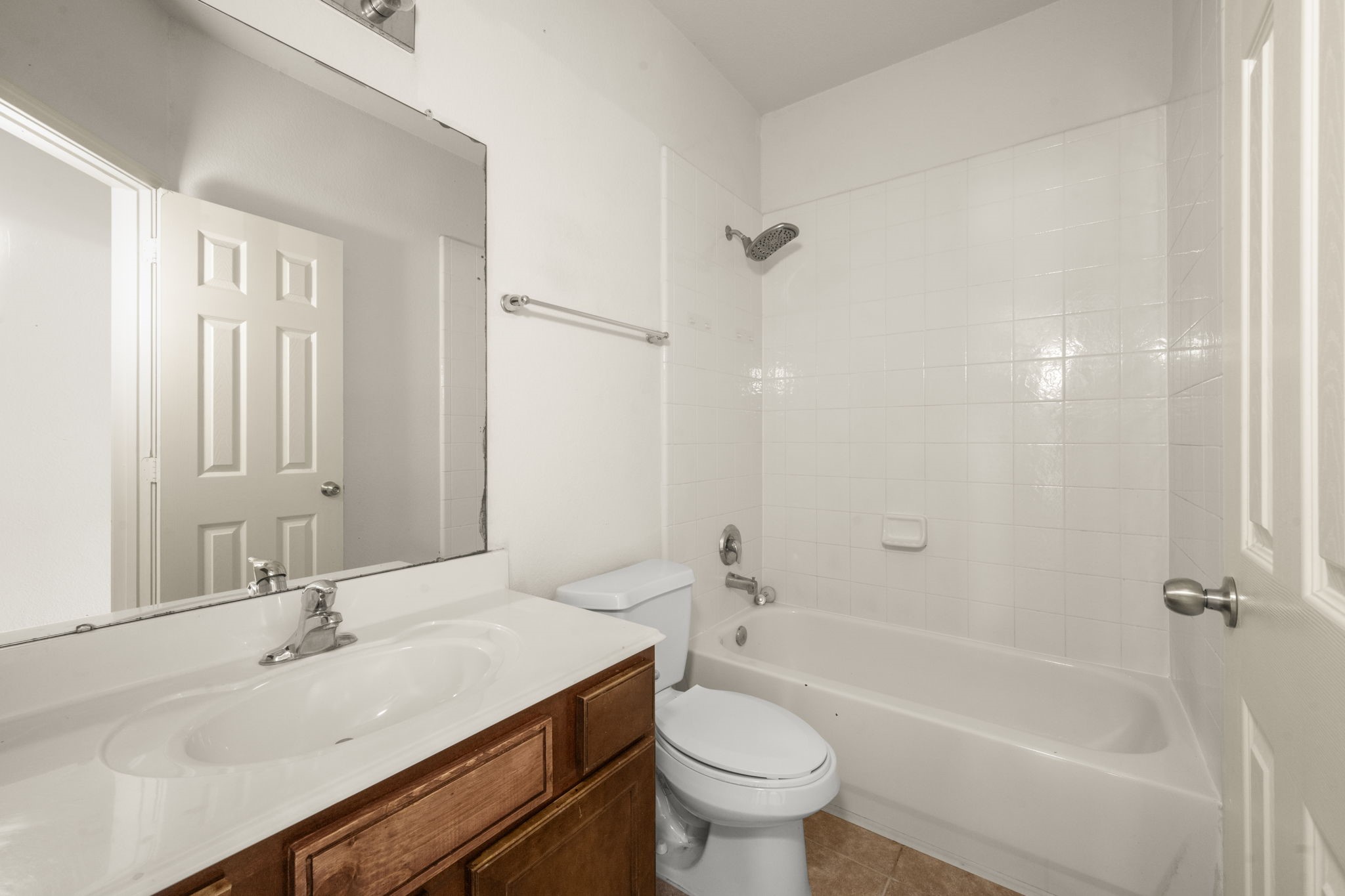 7803 Blue Lake Drive Rosenberg, TX 77469 - Photo 8 of 31 a bathroom with a sink and a mirror