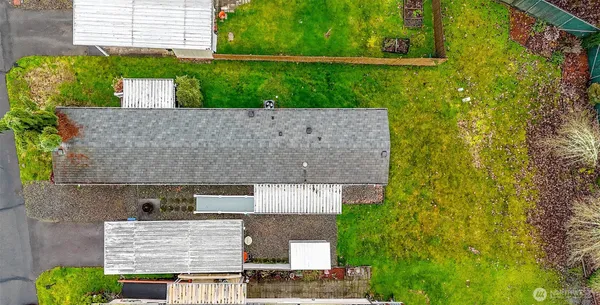 aerial view of a house with a backyard
