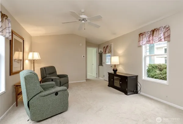a living room with furniture and a window