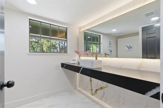 a kitchen with a sink and a window