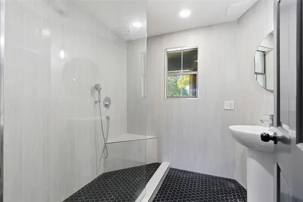a bathroom with a sink and a shower