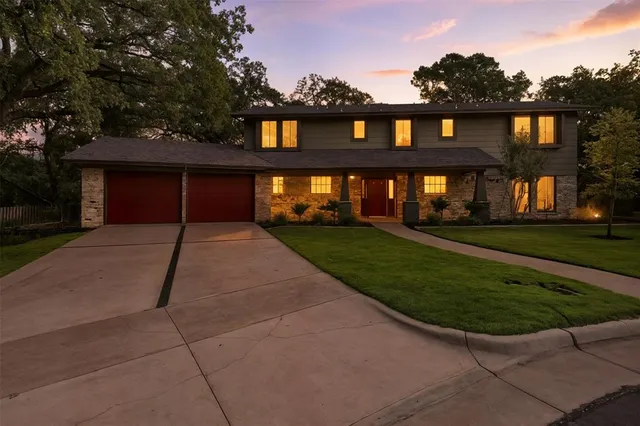 front view of a house with a garden