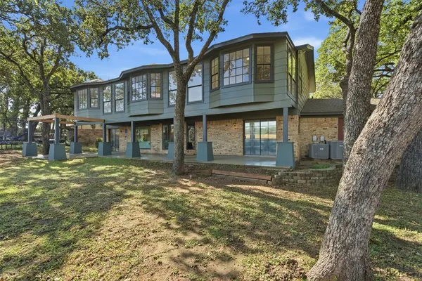 a view of a brick house with a large windows