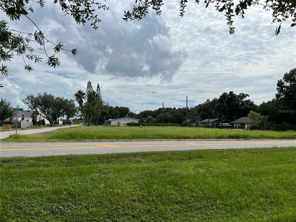 a view of a golf course with a lake