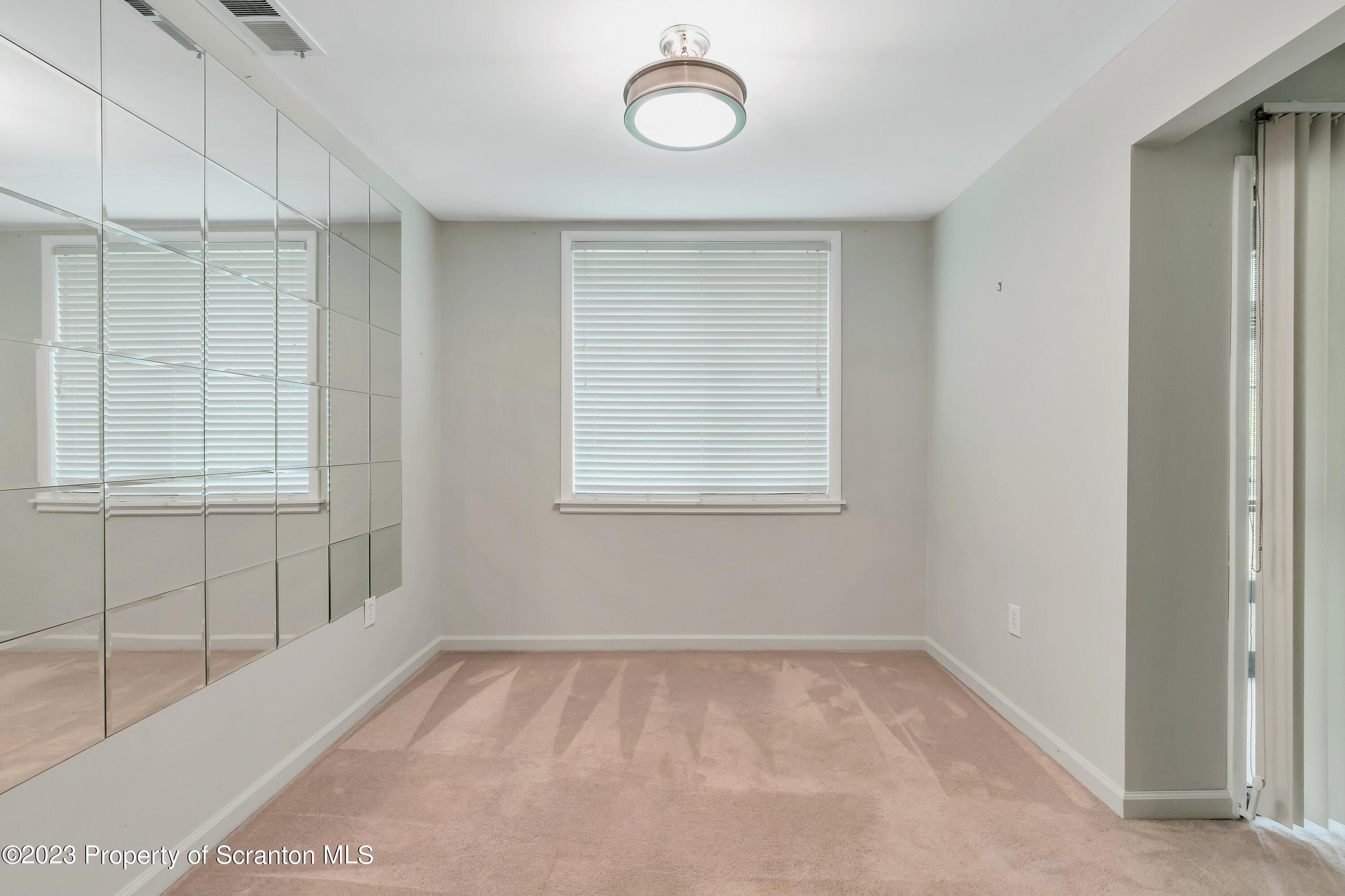 1203 Summit Pointe Scranton, PA 18508 - Photo 6 of 32 a view of a room that has a window in it