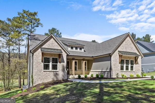 a front view of a house with a yard