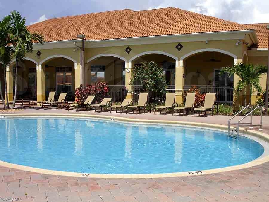 14751 Pinnacle Place Naples, FL 34119 - Photo 8 of 9 a view of swimming pool with outdoor seating