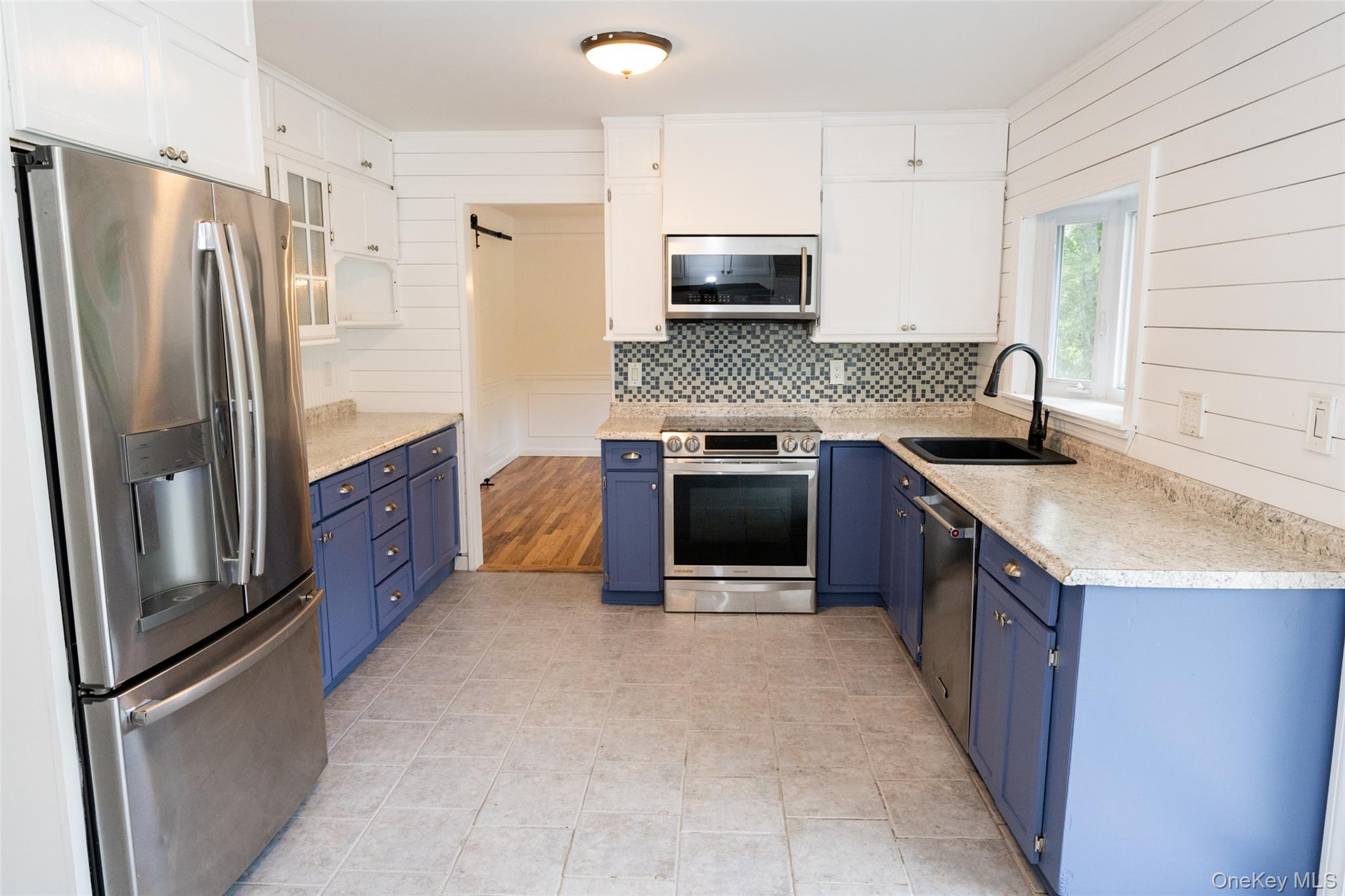 136 Foggintown Road Brewster, NY 10509 - Photo 9 of 50 a kitchen with stainless steel appliances granite countertop a refrigerator stove and sink