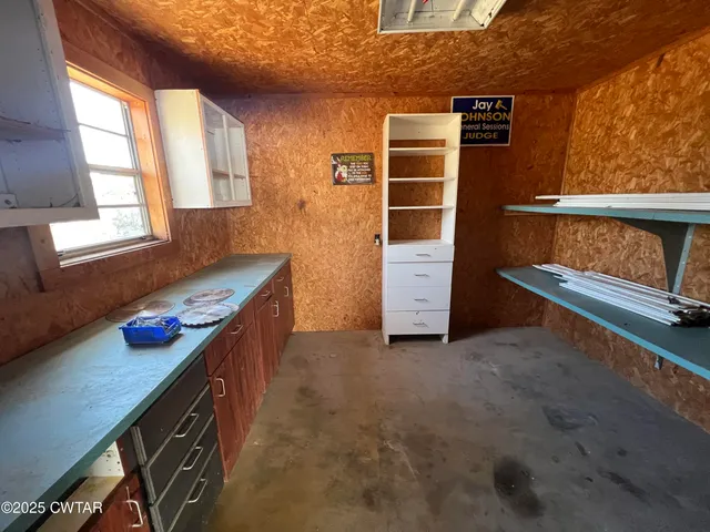 a kitchen that has a stove and a table