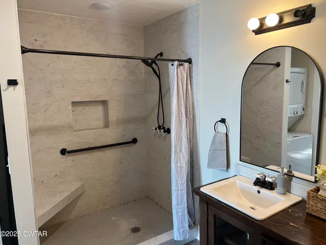 a bathroom with a sink and mirror