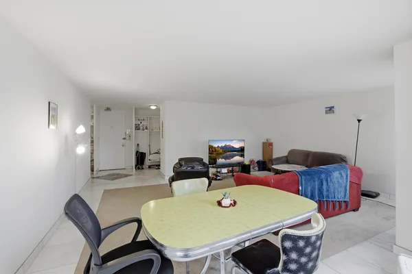 a view of a dining room with furniture and a table