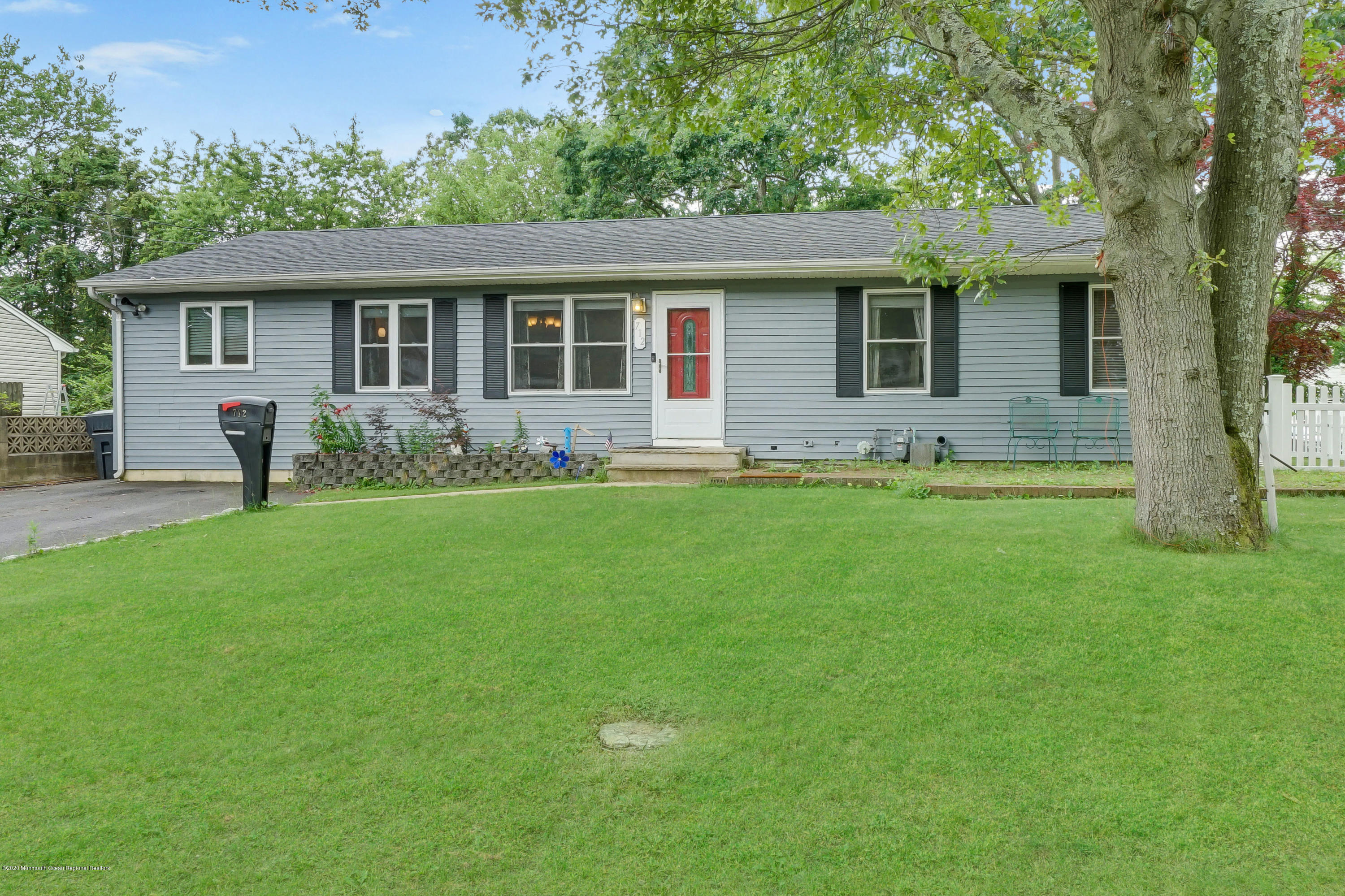 712 Midstreams Road Brick, NJ 08724 - Photo 1 of 33 a front view of house with a garden and trees