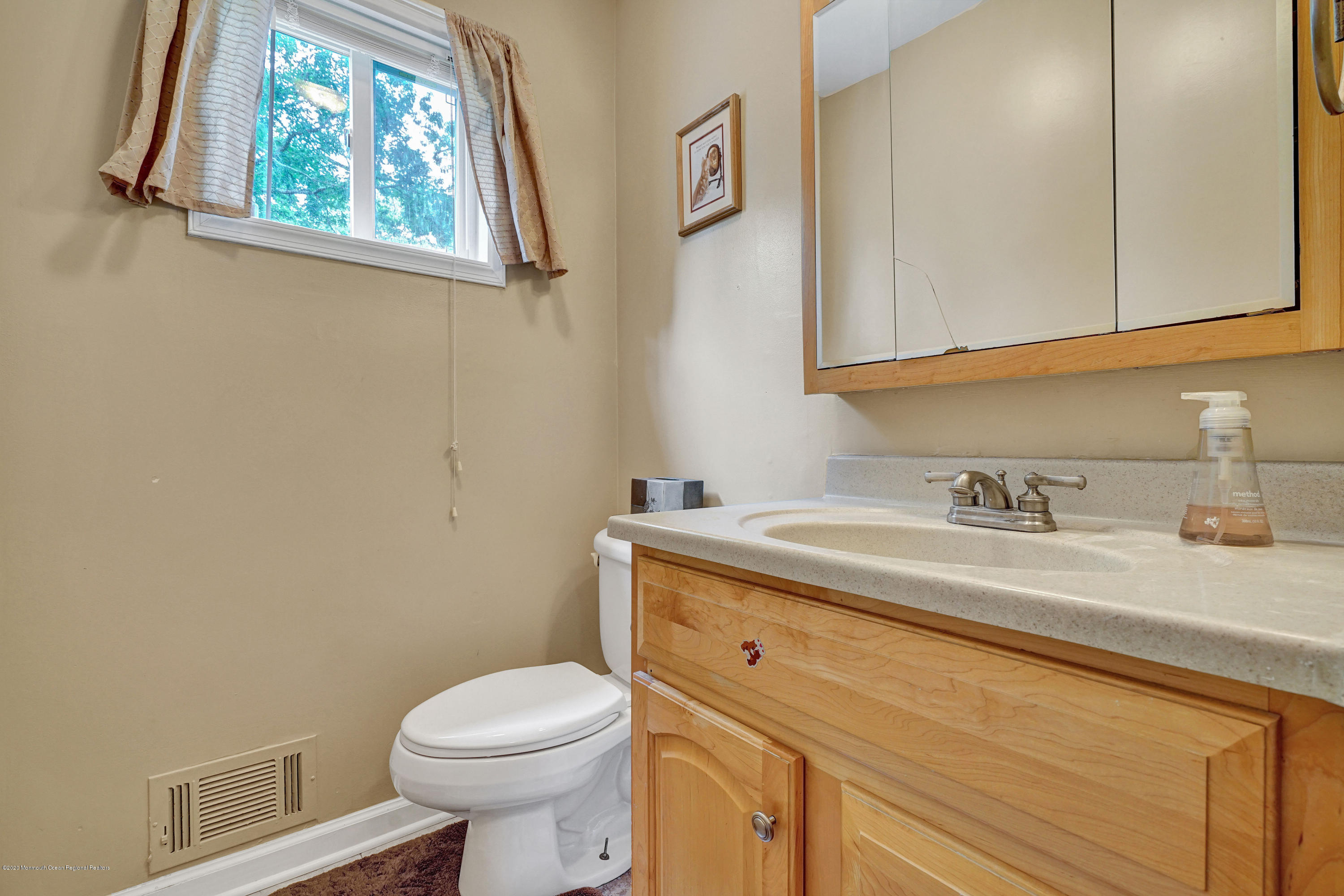 712 Midstreams Road Brick, NJ 08724 - Photo 22 of 33 a bathroom with a granite countertop toilet sink and mirror