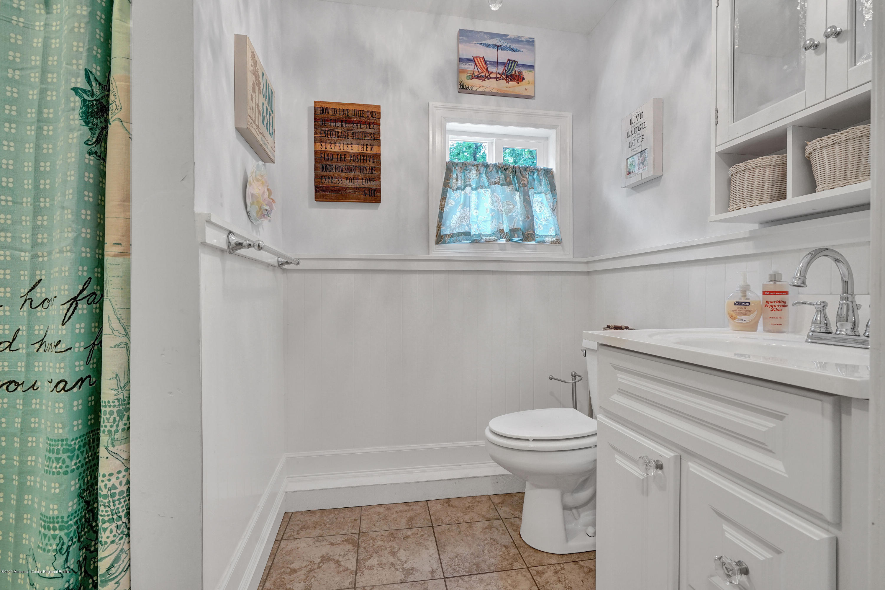 712 Midstreams Road Brick, NJ 08724 - Photo 23 of 33 a bathroom with a sink a toilet and a shower curtain