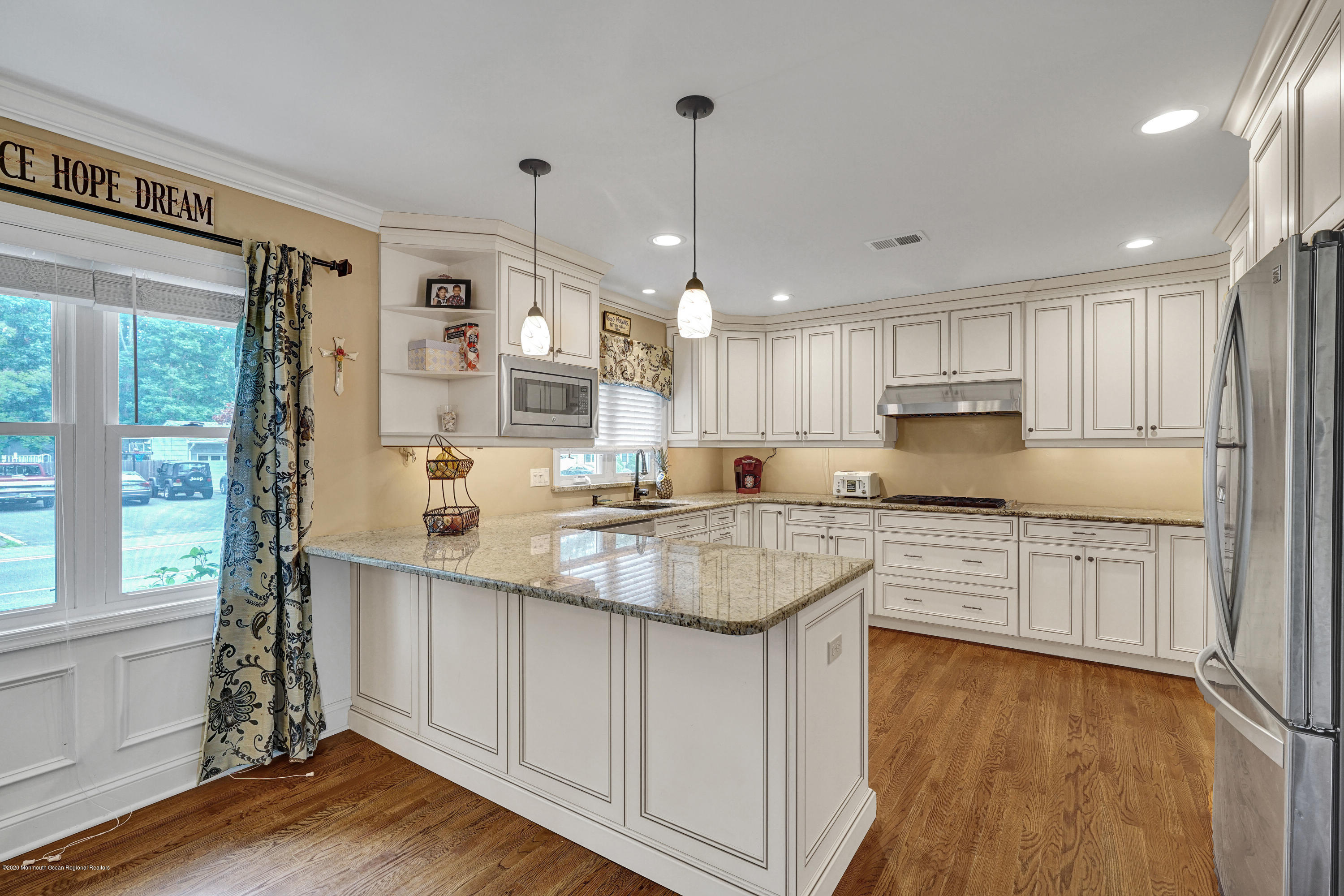 712 Midstreams Road Brick, NJ 08724 - Photo 8 of 33 a kitchen with stainless steel appliances granite countertop a sink cabinets and wooden floor