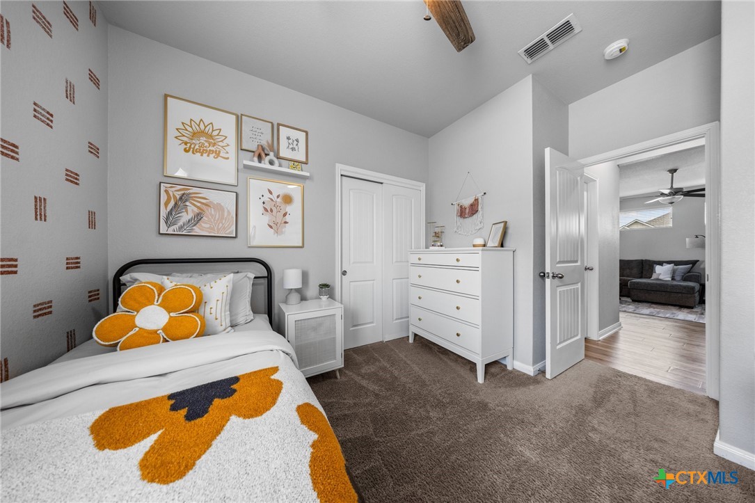 7513 Hudson Grove Drive Temple, TX 76502 - Photo 12 of 38 a bedroom with a bed and furniture