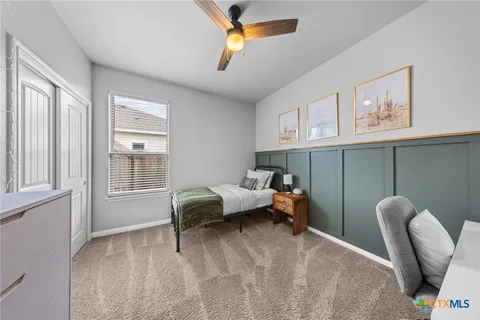 a living room with furniture a air conditioner vent and a window
