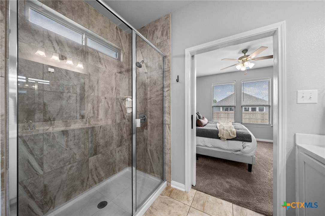 7513 Hudson Grove Drive Temple, TX 76502 - Photo 30 of 38 a en suite bathroom with a shower and toilet