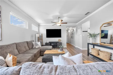 a living room with furniture and a flat screen tv