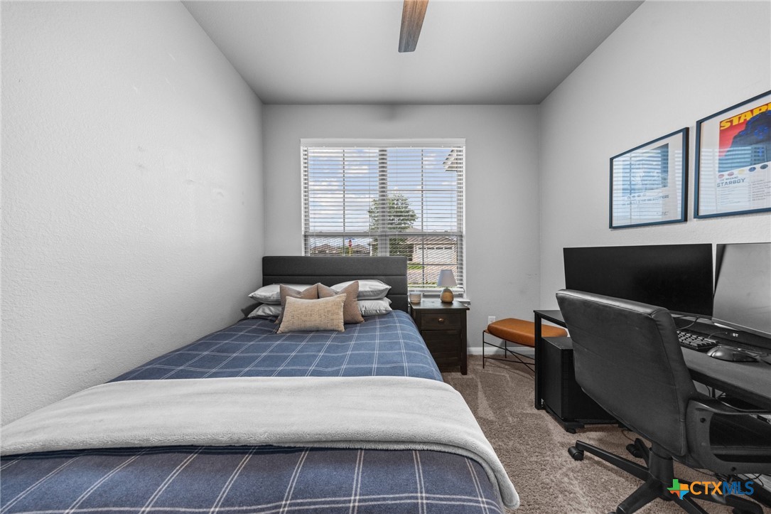 7513 Hudson Grove Drive Temple, TX 76502 - Photo 7 of 38 a living room with furniture and a flat screen tv
