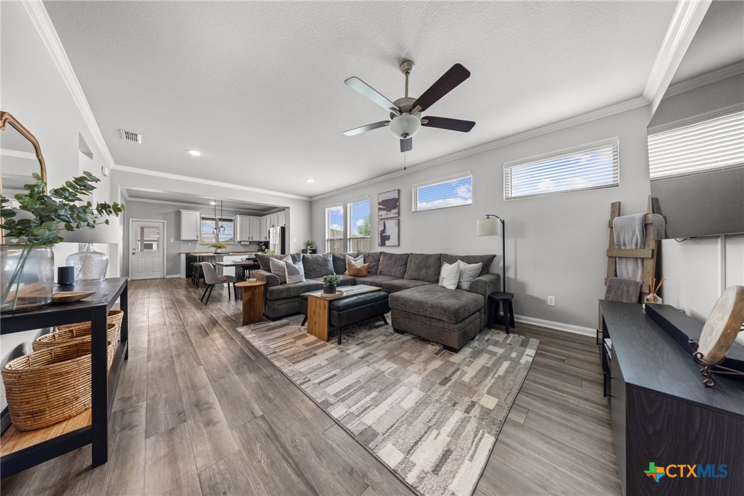 7513 Hudson Grove Drive Temple, TX 76502 - Photo 8 of 38 a living room with furniture and a flat screen tv