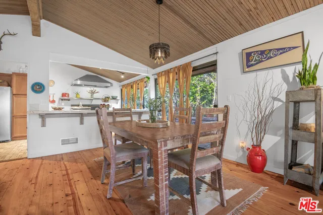 a kitchen with stainless steel appliances granite countertop a refrigerator a sink and a stove