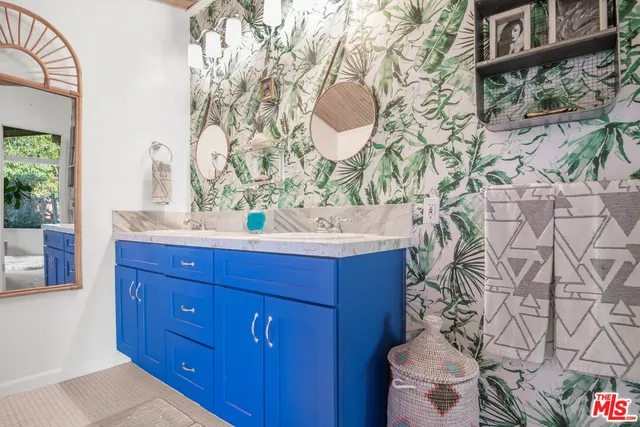 a bathroom with a glass shower door