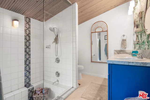 a view of a living room with a window and flower pot