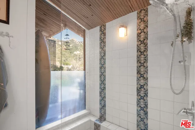 a view of a chairs and table in the patio